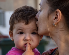 Image of mother and baby celebrating world refugee day in Singapore