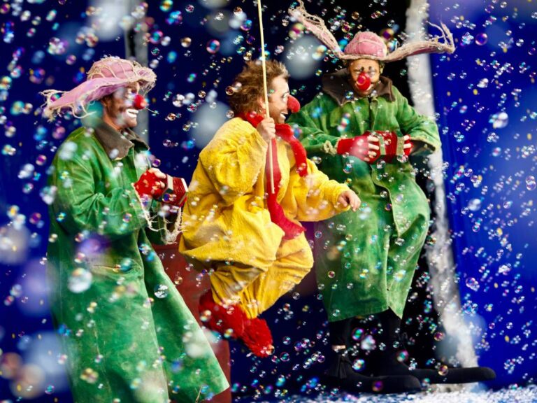Image of Slava's Snowshow with swirling snow and playful clowns at Sands Theatre Singapore