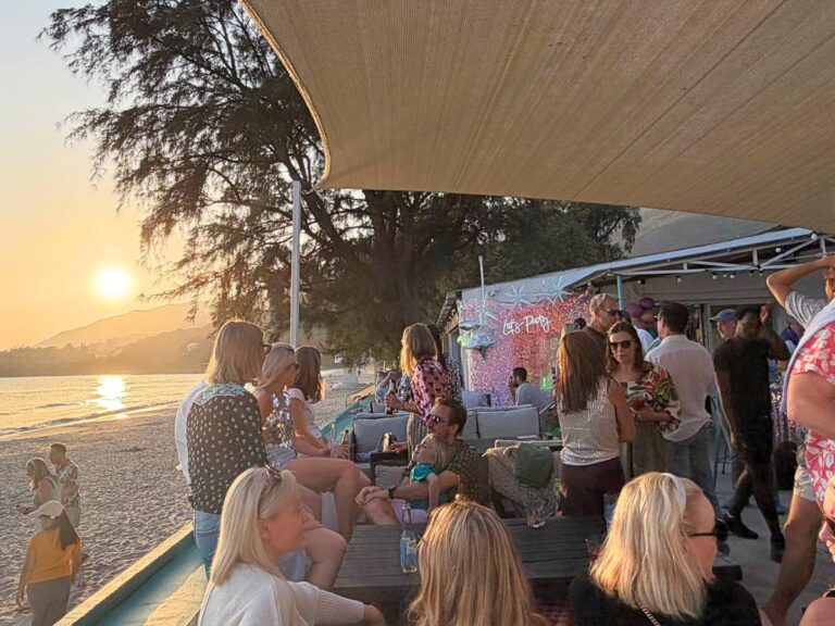 Families enjoying beachfront dining, watersports and relaxing at Treasure Island Beach Club on Pui O Beach, Lantau Island, Hong Kong