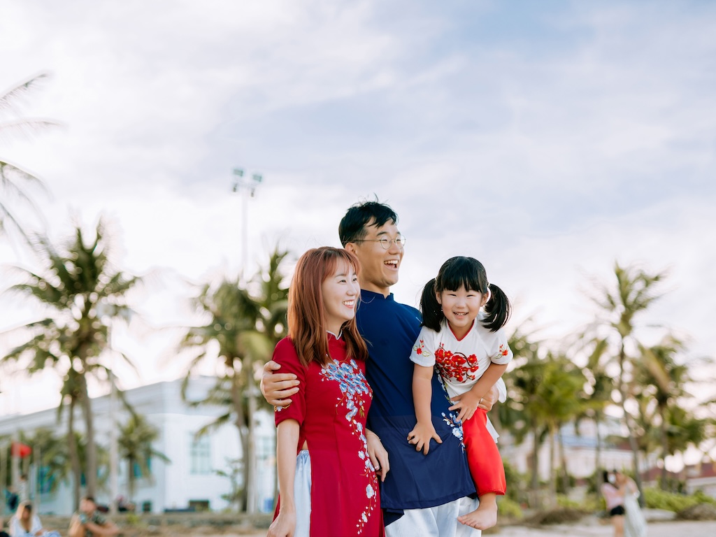 Image of an Asian family looking into the distance