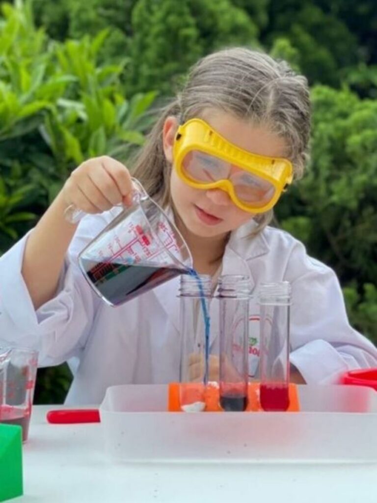 Image of girl doing a science experiment - enrichment class singapore