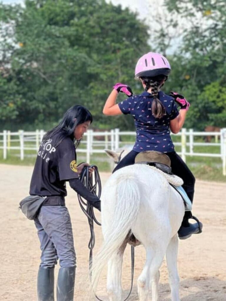 Image of girl riding a horse - enrichment class singapore