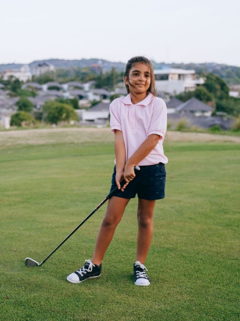 Image of girl playing golf - enrichment class singapore