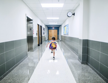 Image of school kids running in hallway - Singapore school openings