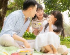 Image of Asian family in the park - life insurance singapore