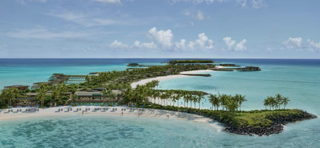 Aerial view of Bvlgari Resort Ranfushi's beach and overwater villas on Raa Atoll, Maldives, with calm turquoise lagoon