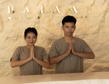 Smiling staff greeting guests at the Level 2 reception desk of Batam 1 Wellness & Massage in Batam