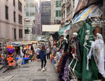 Colorful costumes, wigs and masks on display at market stalls on Pottinger Street in Central, Hong Kong
