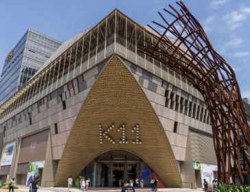 The K11 ECOAST mall entrance in Shekou, Shenzhen, with its giant K11 facade and rust-red outdoor art sculpture